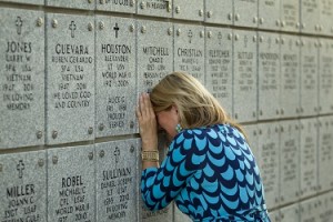 9/11/2012 - Jay Janner/American-Statesman - Kimberly Mitchell weeps at the grave of her husband Chad Mitchell at the Houston National Cemetery in Houston on Tuesday Sept. 11, 2012. Chad Mitchell, an Iraq War veteran, died of an accidental overdose in 2010.