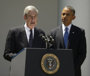 President Barack Obama, right, listens to outgoing FBI Director Robert Mueller, left, during Obama's announcement at he will nominate James Comey, a senior Justice Department official under President George W. Bush, to replace Mueller, as director of the F.B.I., in the Rose Garden of the White House on Friday, June 21, 2013, in Washington. (AP Photo/Pablo Martinez Monsivais)